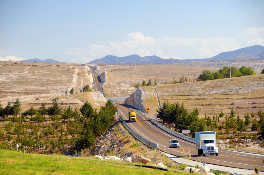 Photo of trucks on highway in Mexico, meant to symbolize the trend of nearshoring in Mexico.