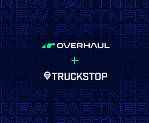 Blue background saying "New Partner" with text in middle showing Overhaul and Truckstop's logos.