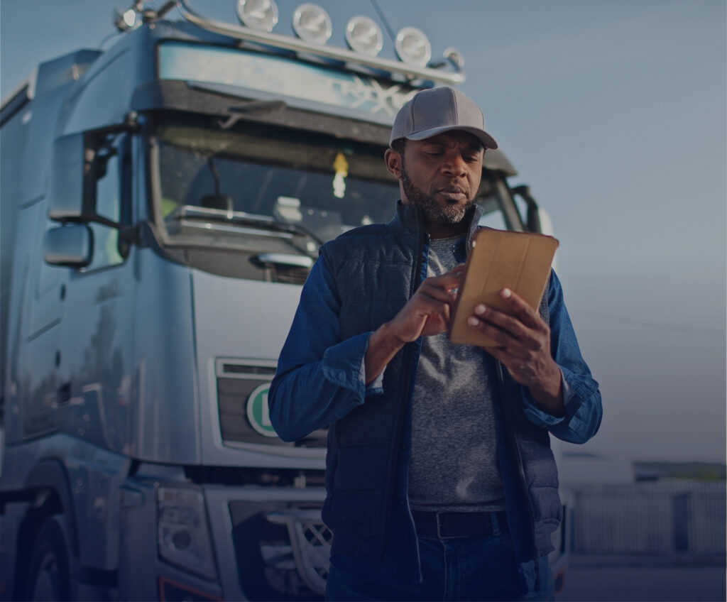 Person by truck looking through carrier vetting questionnaire.
