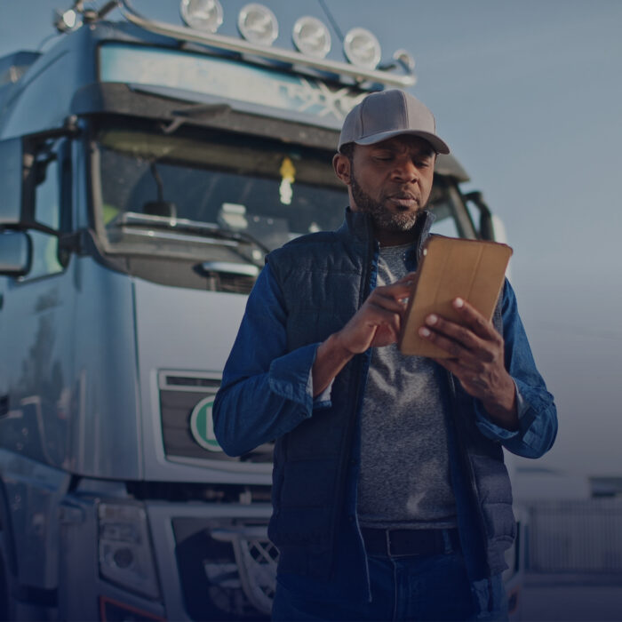 Person by truck looking through carrier vetting questionnaire.