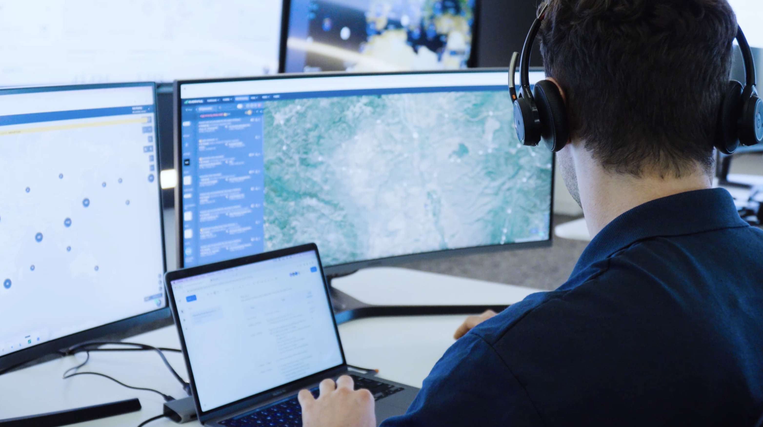 GSOC officer sits at his station helping customers manage risk.