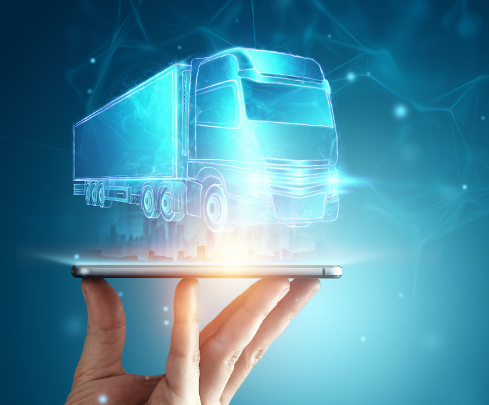A truck on a tablet with a blue background, being held up by a hand, meant to symbolize Overhaul's device agnostic, consultative approach.