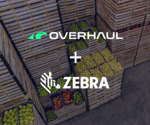 Overhaul and Zebra'a logos in front of crates of food.